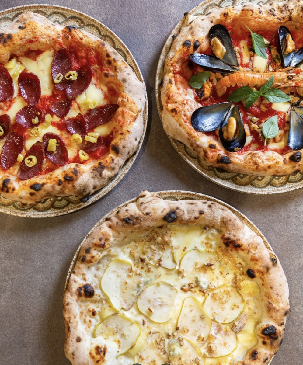 A trio of wood-fired pizzas