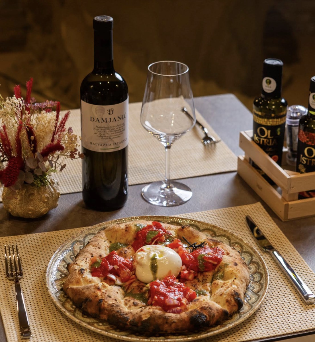 Burrata pizza with a glass of wine